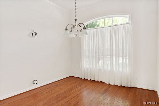 9533 Ashleyville Turn, Midlothian, VA 23112 - unfurnished dining area with a chandelier, wood-type flooring, baseboards, and crown molding