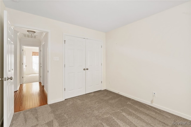 9533 Ashleyville Turn, Midlothian, VA 23112 - unfurnished bedroom featuring carpet, attic access, a closet, and baseboards