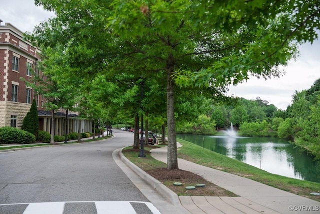 view of home's community with a water view