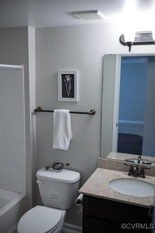 bathroom with toilet and vanity
