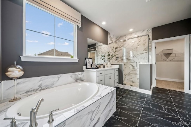 2710 Maidens Rd, Powhatan, VA 23139 - bathroom featuring vanity, marble finish floor, a walk in closet, a bath, and a shower stall
