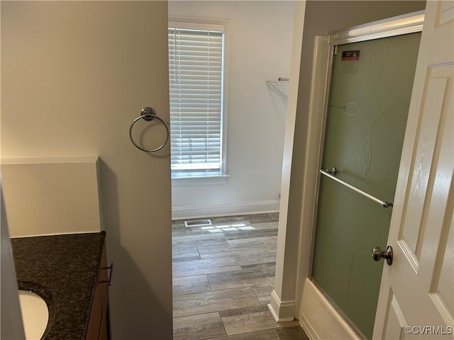 7404 Newbys Ct, Chesterfield, VA 23832 - bathroom with visible vents, vanity, wood finished floors, baseboards, and combined bath / shower with glass door