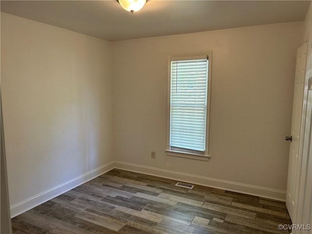 7404 Newbys Ct, Chesterfield, VA 23832 - empty room featuring baseboards, visible vents, and dark wood-type flooring