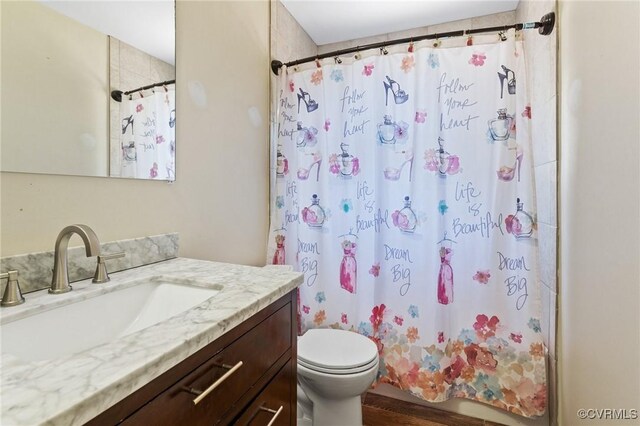 31 Warren Dr, Newport News, VA 23608 - full bathroom featuring toilet, vanity, shower / tub combo, and wood finished floors