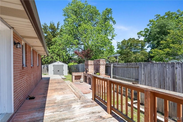 31 Warren Dr, Newport News, VA 23608 - deck featuring a storage shed, a fenced backyard, and an outbuilding