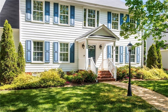 colonial home with a front yard