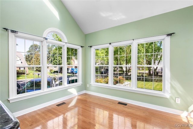 unfurnished sunroom with visible vents and plenty of natural light