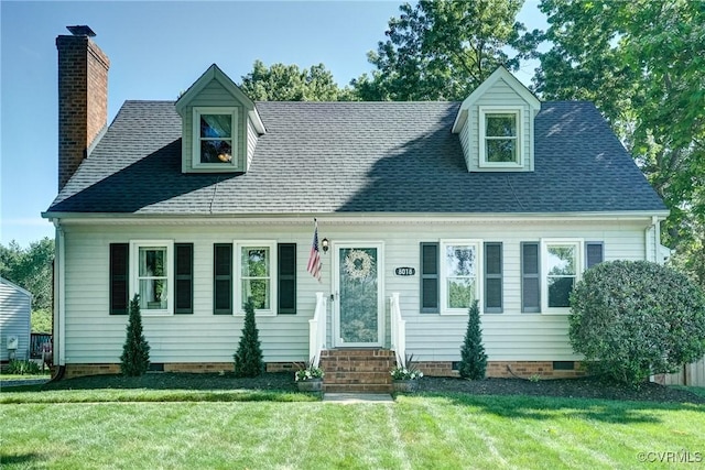 cape cod-style house with a front yard, a chimney, crawl space, and roof with shingles