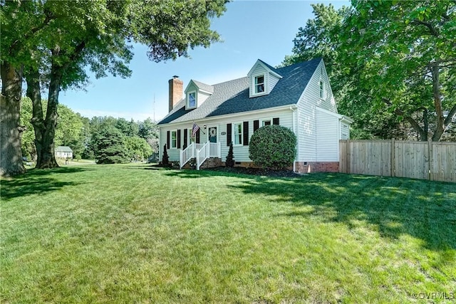 new england style home with crawl space, a chimney, and a shingled roof