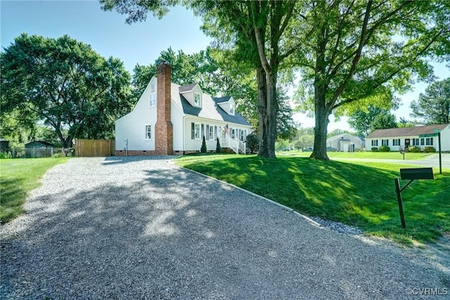 view of home's exterior with crawl space, a chimney, and driveway