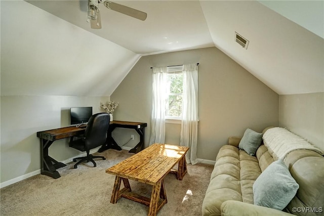 office with a ceiling fan, carpet flooring, vaulted ceiling, and baseboards