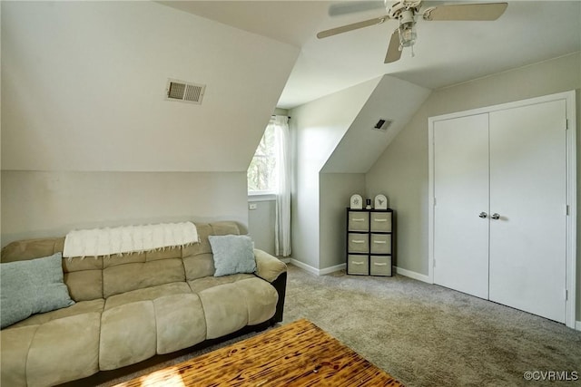 living area with carpet flooring, ceiling fan, vaulted ceiling, and baseboards