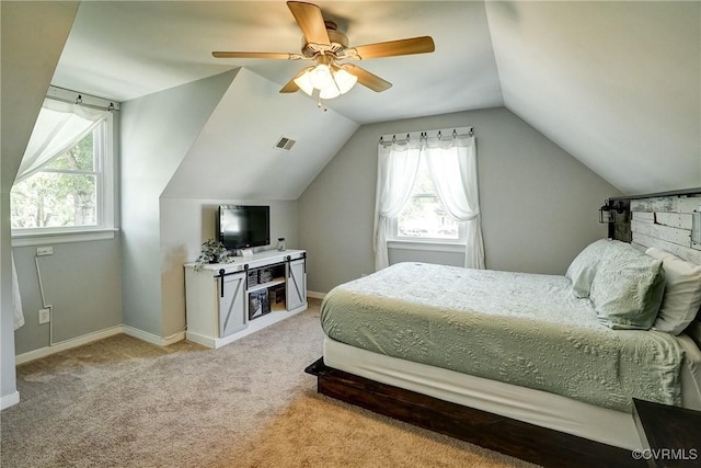 carpeted bedroom featuring lofted ceiling, ceiling fan, and baseboards
