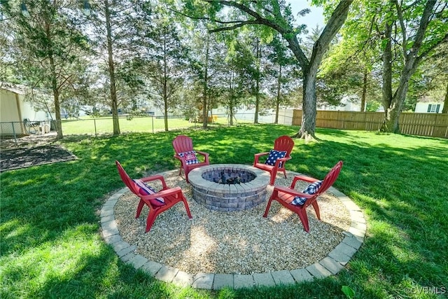 view of yard with a fire pit