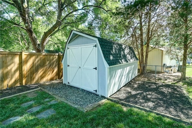 view of shed featuring a fenced backyard