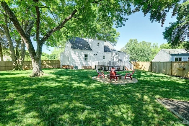 view of yard with a fire pit and a deck