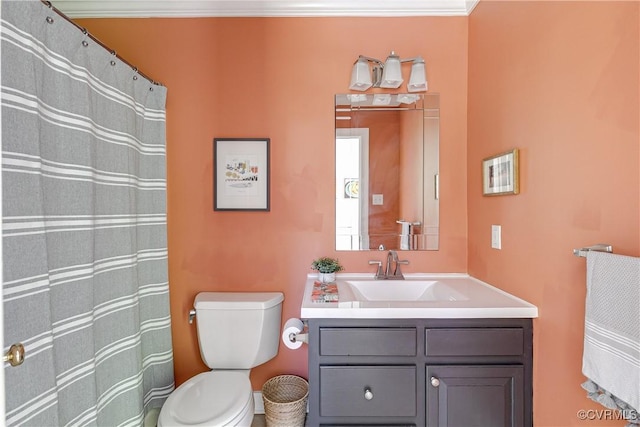 full bathroom with crown molding, toilet, and vanity