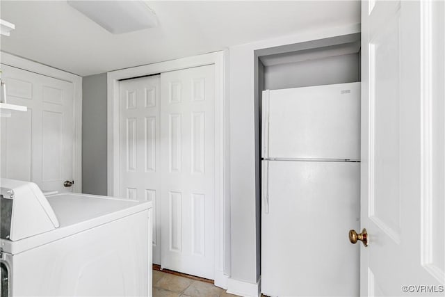 laundry room featuring laundry area and washer / dryer
