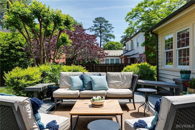 deck featuring fence and an outdoor living space