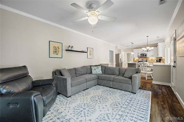 living area featuring visible vents, baseboards, ceiling fan with notable chandelier, ornamental molding, and dark wood-type flooring