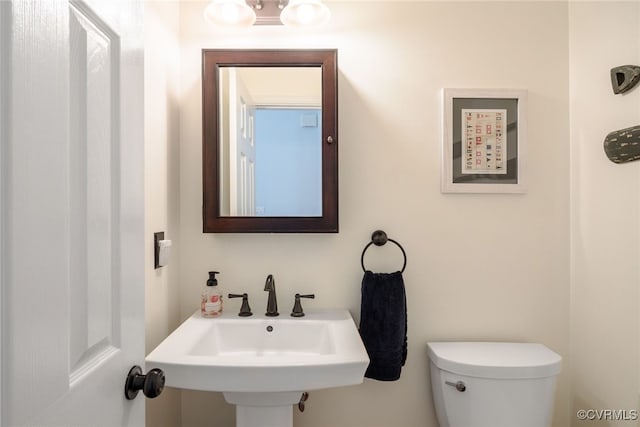 bathroom with a sink and toilet