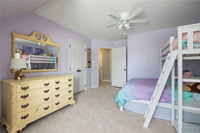 bedroom with a ceiling fan and light colored carpet