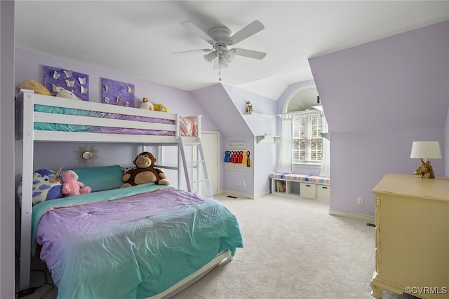 carpeted bedroom featuring baseboards, ceiling fan, and lofted ceiling
