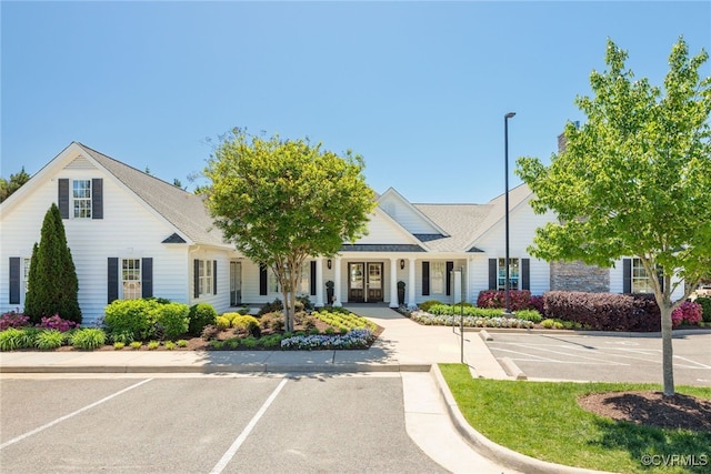 view of property with uncovered parking