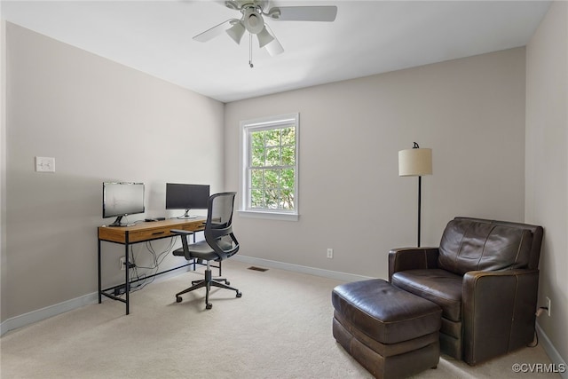 office with carpet floors, baseboards, and a ceiling fan