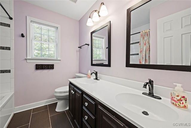 full bath with baseboards, a sink, tile patterned flooring, and toilet