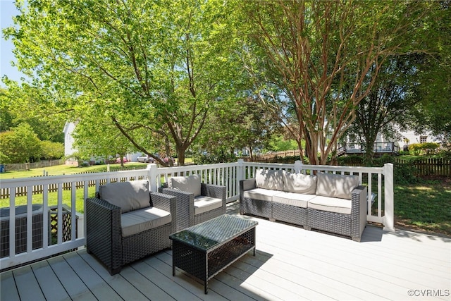 wooden deck featuring fence and an outdoor living space