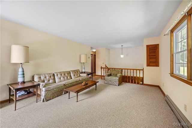 carpeted living room with baseboards and baseboard heating