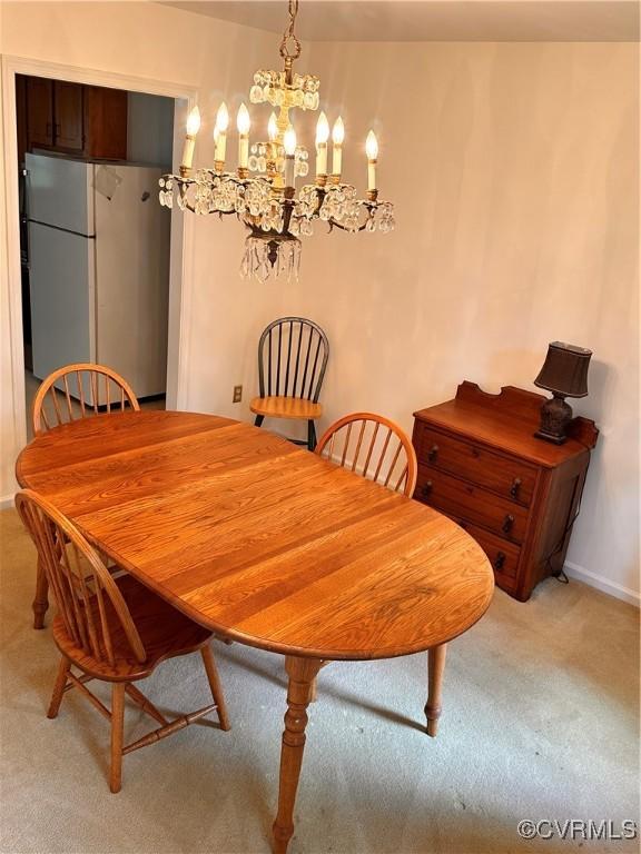4805 Candlelight, Henrico, VA 23060 - dining space featuring light carpet, baseboards, and a chandelier
