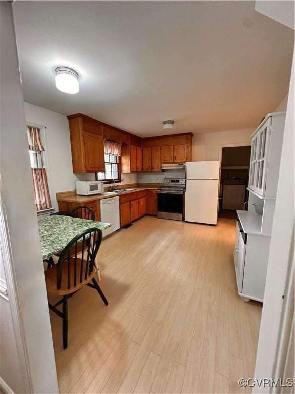 4805 Candlelight, Henrico, VA 23060 - kitchen with white appliances, light wood-style floors, and brown cabinetry