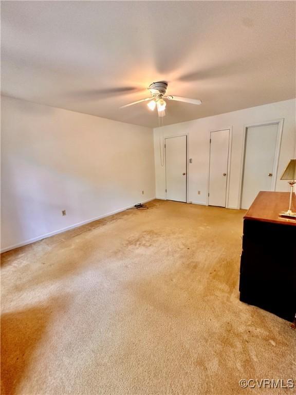 4805 Candlelight, Henrico, VA 23060 - unfurnished bedroom with light colored carpet, multiple closets, baseboards, and ceiling fan