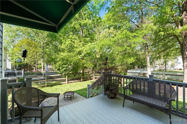 deck with fence and a yard