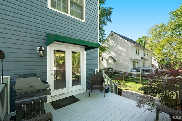 wooden terrace with a grill
