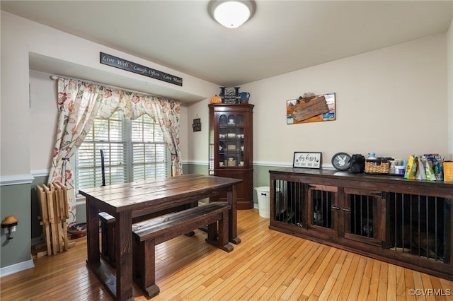 dining space featuring light wood finished floors
