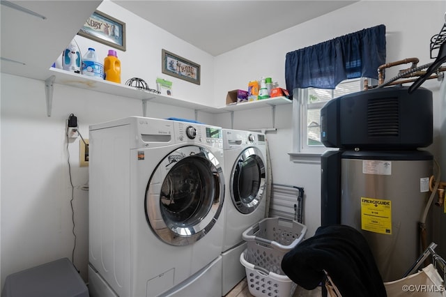 laundry area featuring separate washer and dryer and laundry area