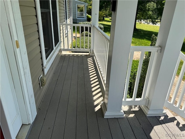 wooden terrace with a porch