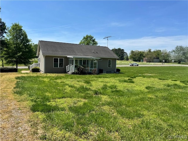 back of house with a yard