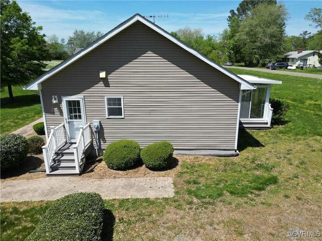 view of property exterior featuring a lawn