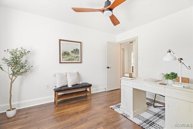 home office with baseboards, ceiling fan, and wood finished floors