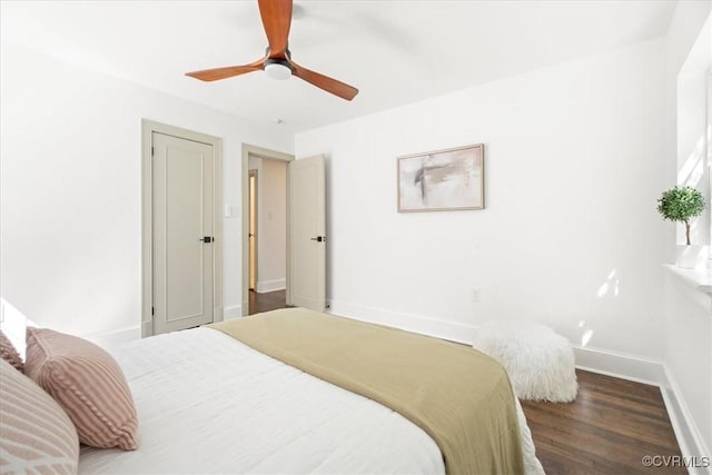 bedroom with baseboards, a ceiling fan, and wood finished floors