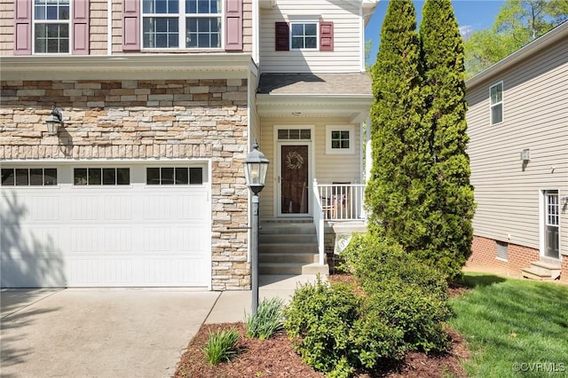 entrance to property with driveway and stone siding