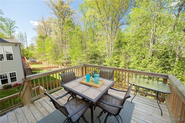 wooden deck with outdoor dining space