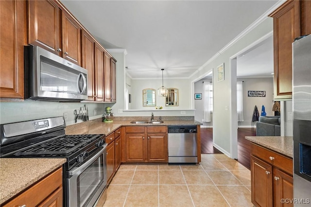 kitchen with brown cabinetry, crown molding, appliances with stainless steel finishes, a sink, and light tile patterned floors