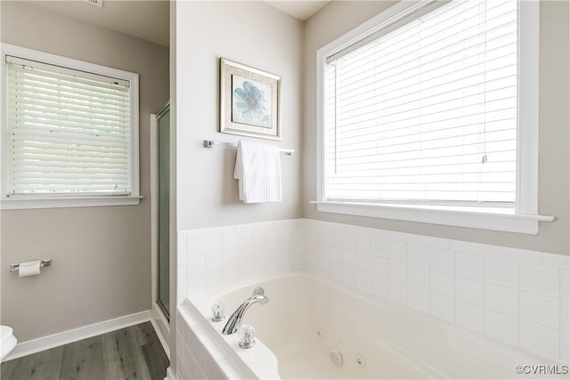 8134 Falling Leaf Ct, Mechanicsville, VA 23111 - bathroom featuring a whirlpool tub, a shower stall, and wood finished floors