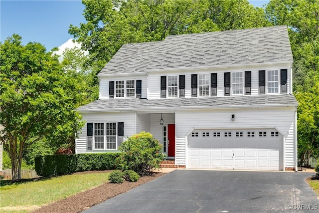 8134 Falling Leaf Ct, Mechanicsville, VA 23111 - view of front of home with driveway, an attached garage, and a shingled roof