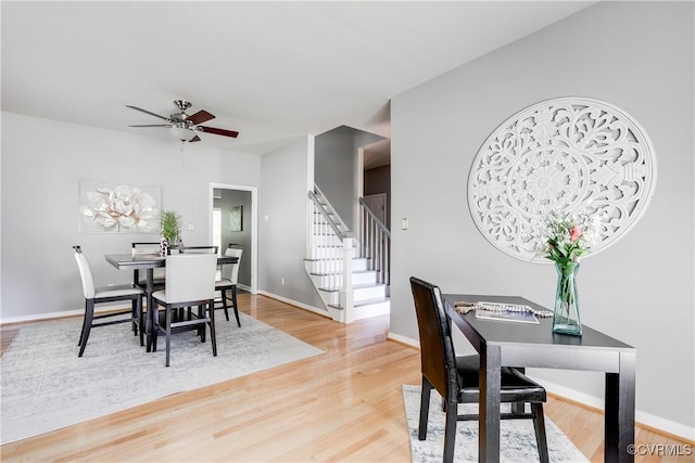 8134 Falling Leaf Ct, Mechanicsville, VA 23111 - dining room with stairway, light wood finished floors, and a ceiling fan